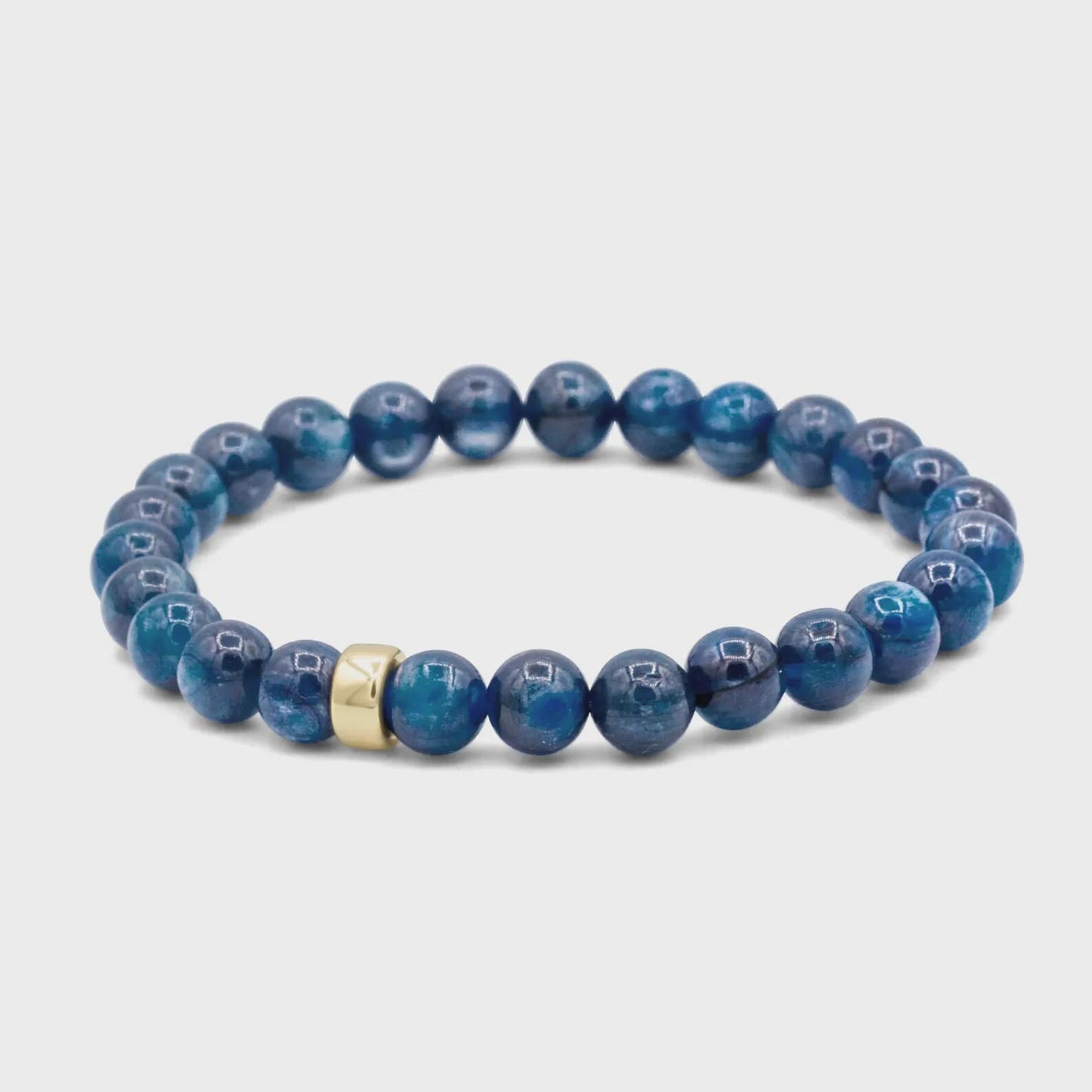 Kyanite bracelet featuring polished blue stones from Earthly Abundance Jewelry, displayed on a neutral background.
