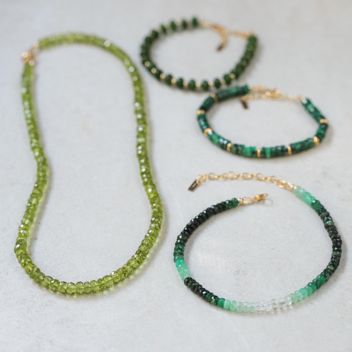 14K Peridot necklace featuring a vibrant green gemstone on a delicate chain, crafted by Earthly Abundance.