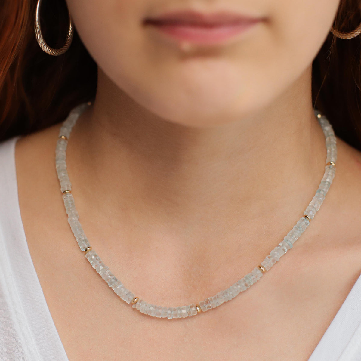 Blue Topaz Heishi necklace featuring small, round, blue topaz beads on a delicate string, crafted by Earthly Abundance.