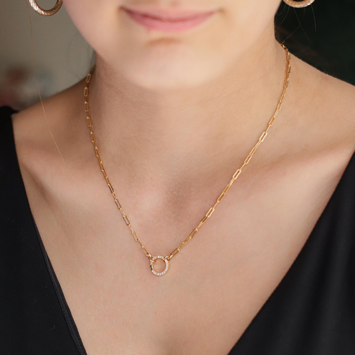 Pink sapphire or white topaz carabiner jewelry clasp with gold-tone finish, showcasing a polished, elegant design.