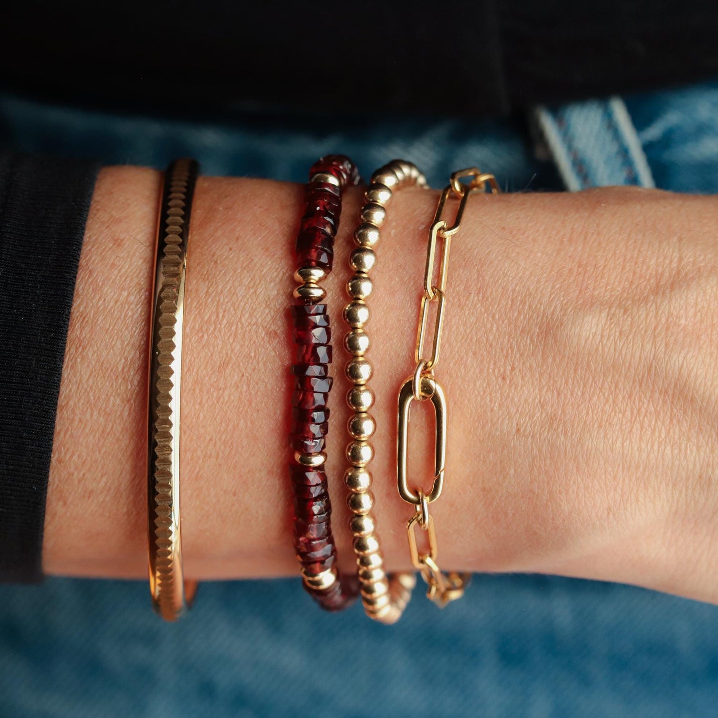 Devotion Garnet Bracelet by Earthly Abundance featuring deep red garnet stones on a delicate silver chain.