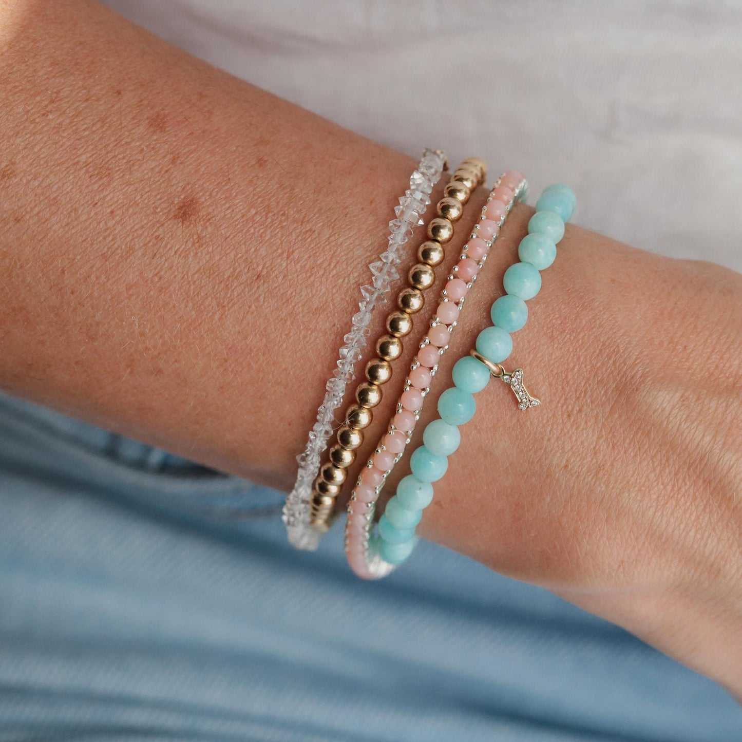Pink Opal Tennis Bracelet by Earthly Abundance featuring a string of polished pink opal beads on a delicate silver chain.