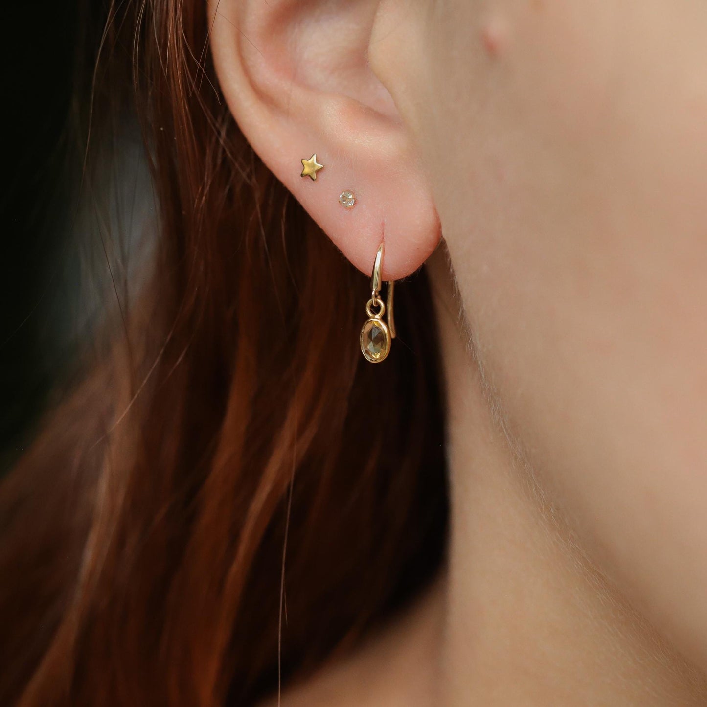 Yellow sapphire drop earrings in 14K gold featuring elegant teardrop-shaped stones and a delicate gold setting.