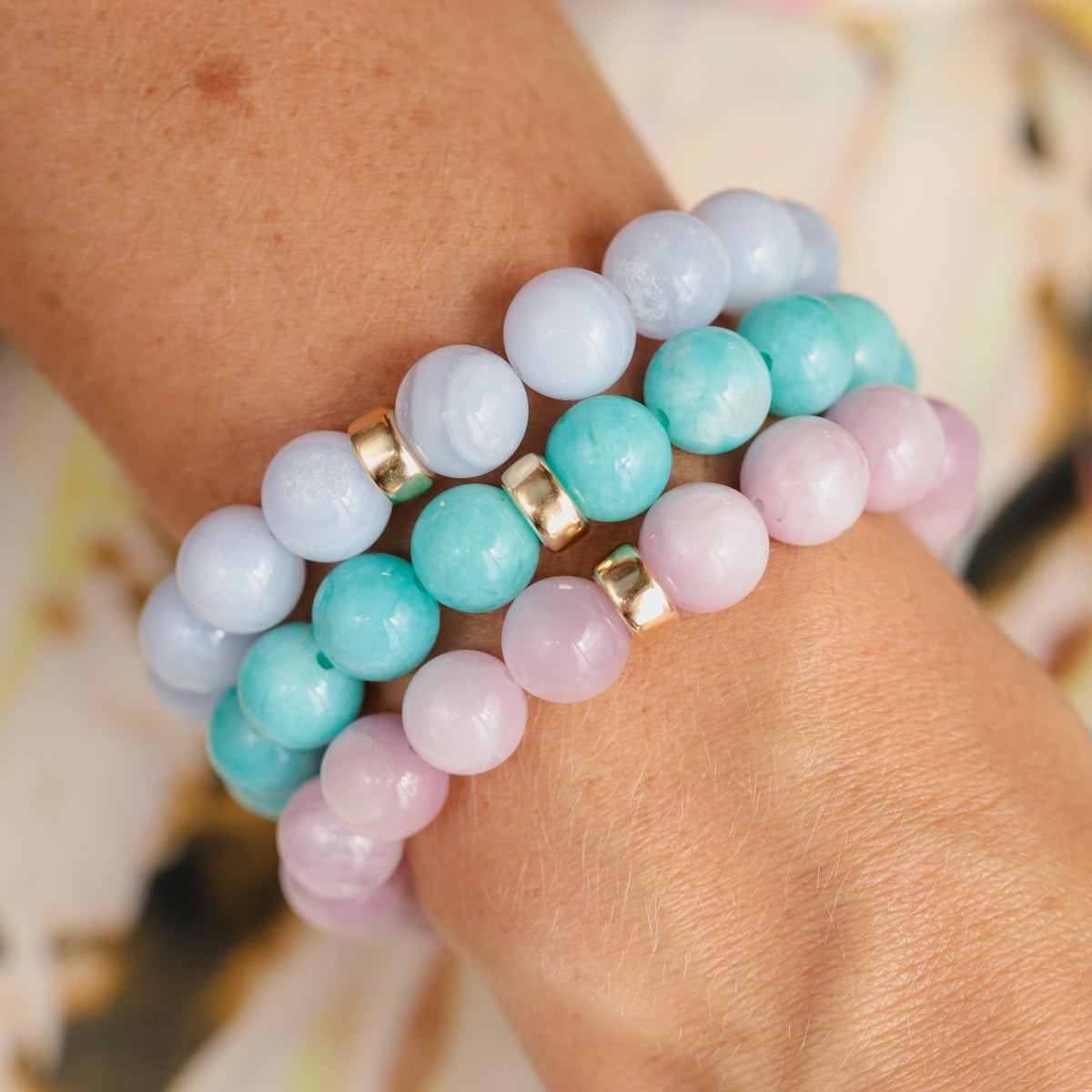 Blue lace agate 10mm gemstone bead from Earthly Abundance, showcasing smooth, polished blue and white banded stone.