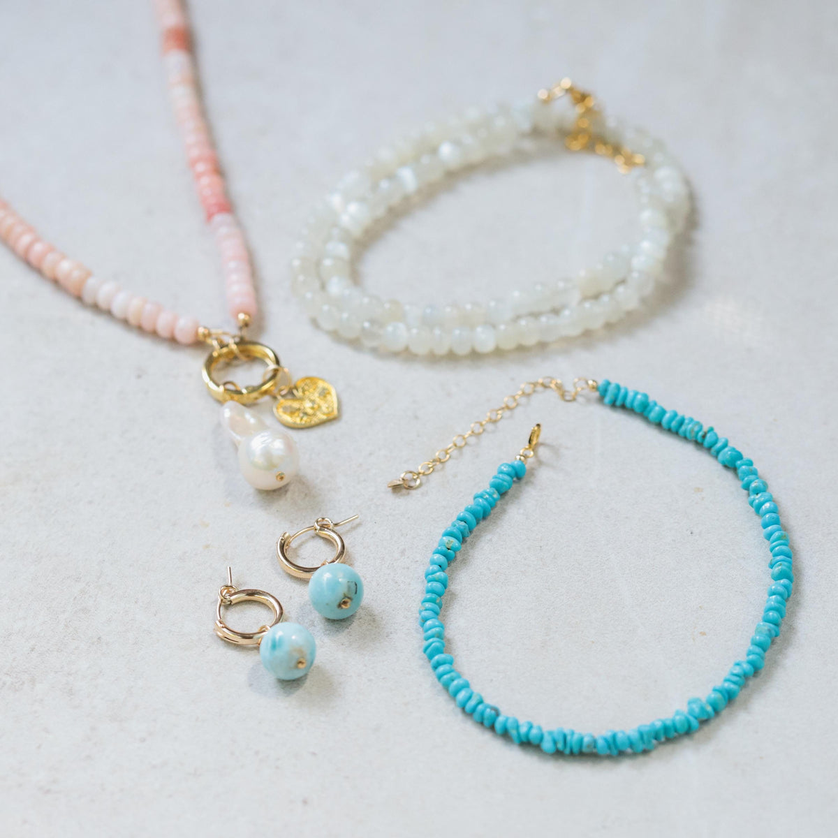 Sleeping Beauty turquoise anklet by Earthly Abundance featuring a delicate chain with turquoise bead accents and a decorative charm.