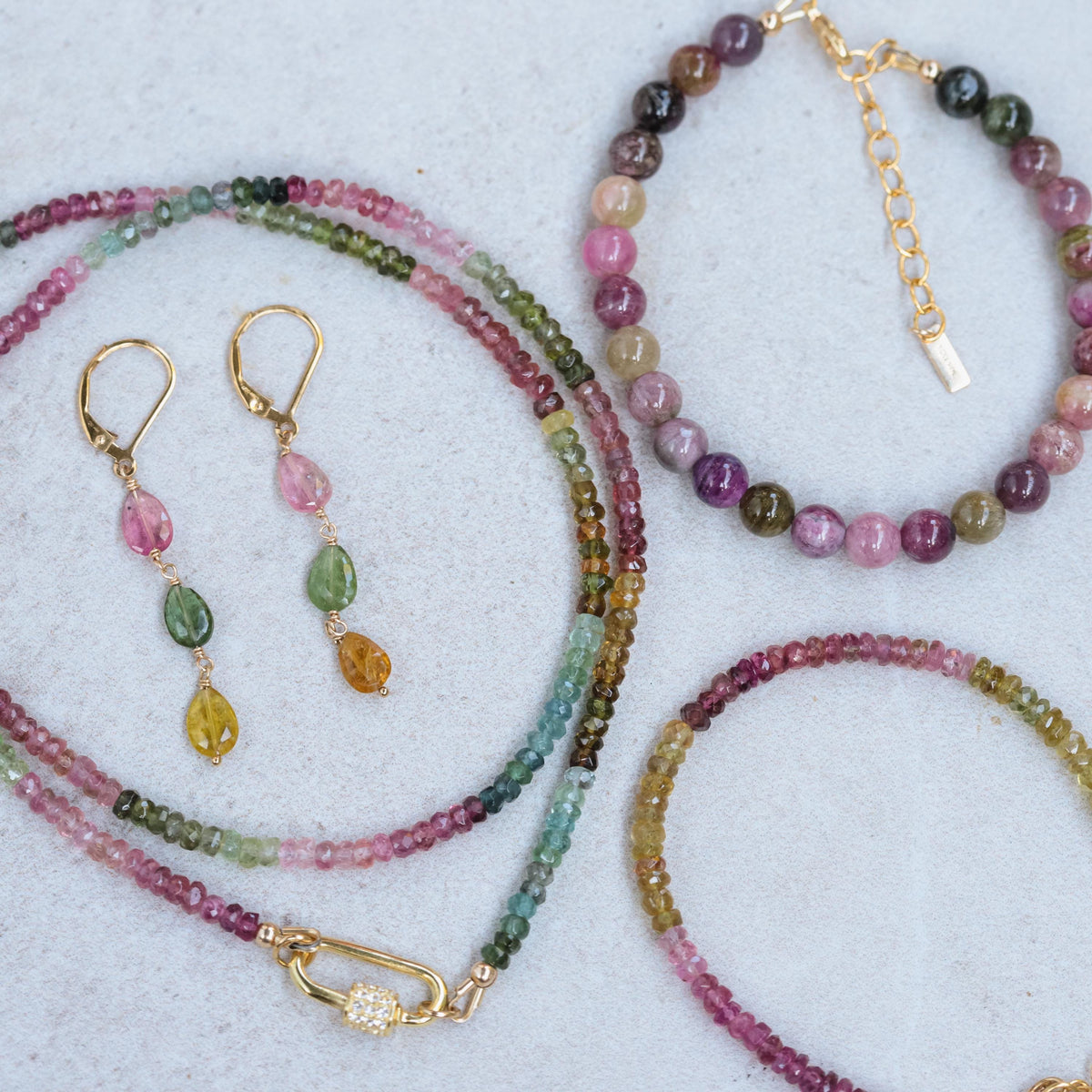 Delicate mixed tourmaline drop earrings by Earthly Abundance featuring colorful gemstone teardrops on silver hooks.