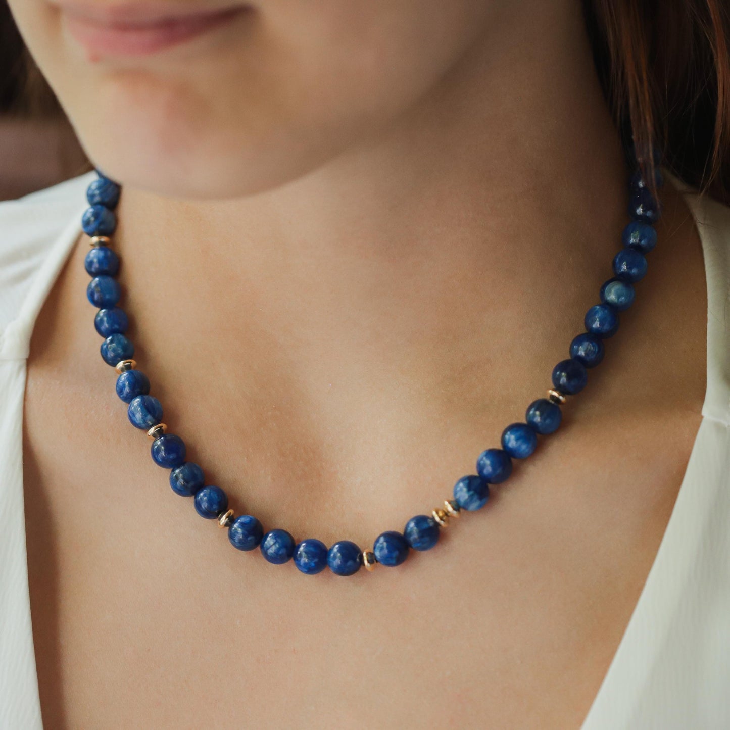 Kyanite energy necklace by Earthly Abundance featuring a polished blue kyanite pendant on a cord.