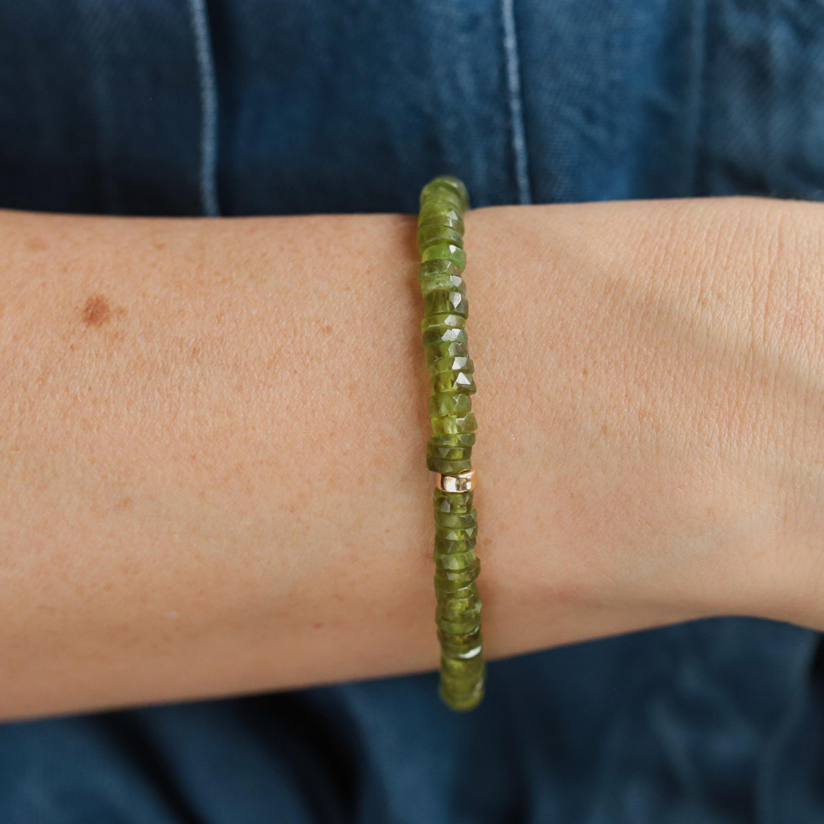 Vessonite Heishi bracelet by Earthly Abundance featuring smooth, round Vessonite gemstone beads on a stretch cord.