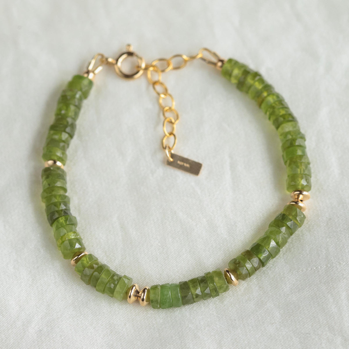 Vessonite beaded bracelet with 14K gold-filled accents by Earthly Abundance, showcasing vibrant gemstone beads and elegant design.