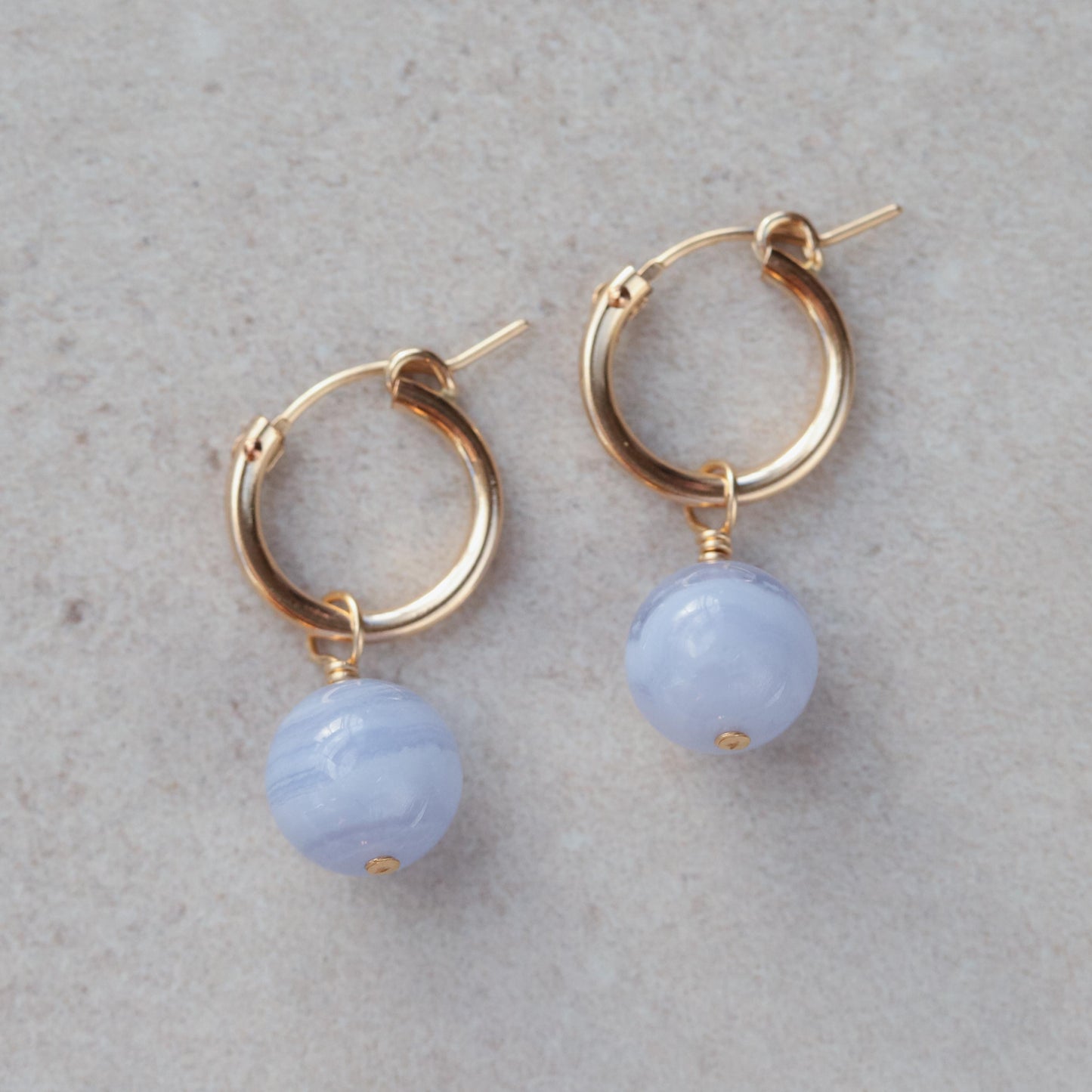 Blue Lace Agate hoop earrings with 14K gold-filled hoops, featuring polished blue gemstone beads and delicate gold accents.
