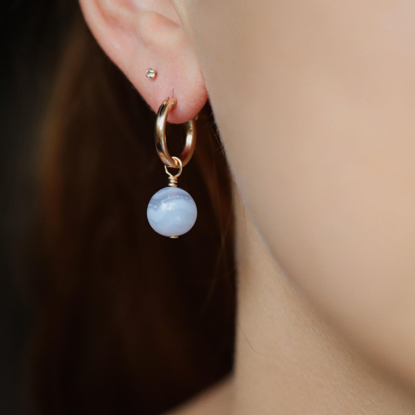 Blue lace agate hoop earrings with 14K gold-filled details, featuring delicate lace patterns and a polished finish.