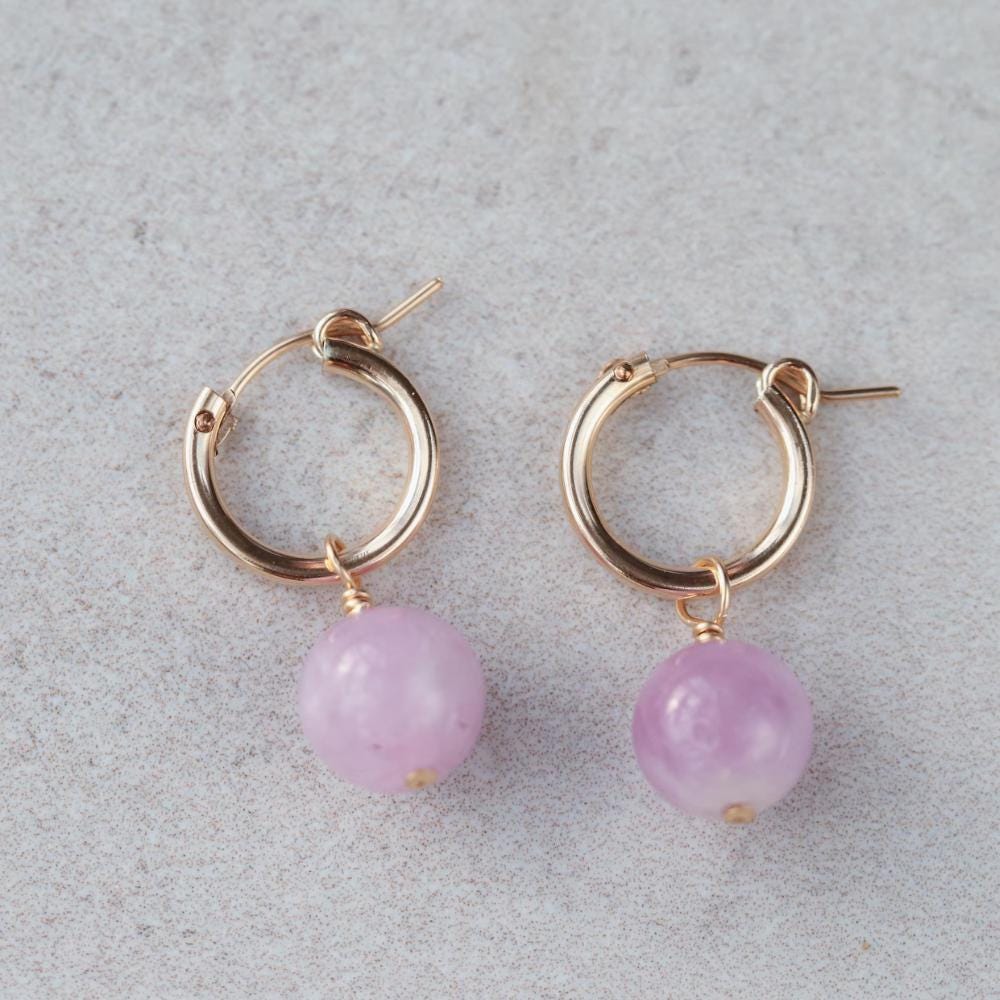 Kunzite hoop earrings with 14K gold filled setting, featuring pink kunzite stones and gold hoops, from Earthly Abundance.