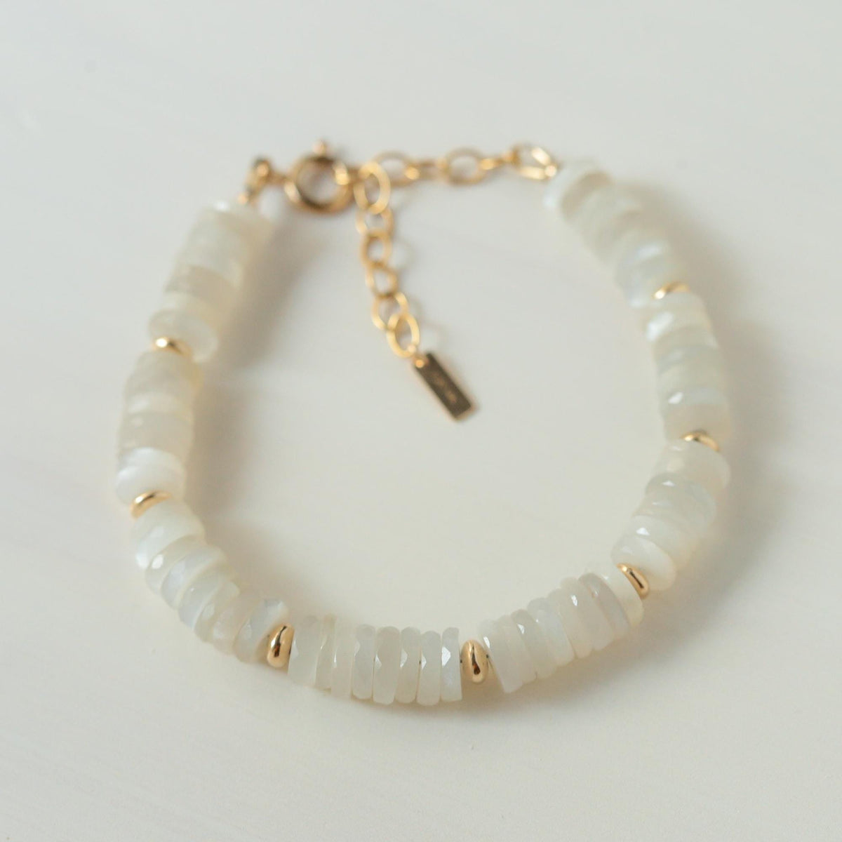 Ivory Tide Moonstone Bracelet by Earthly Abundance featuring smooth, polished moonstone beads on an elegant bracelet design.