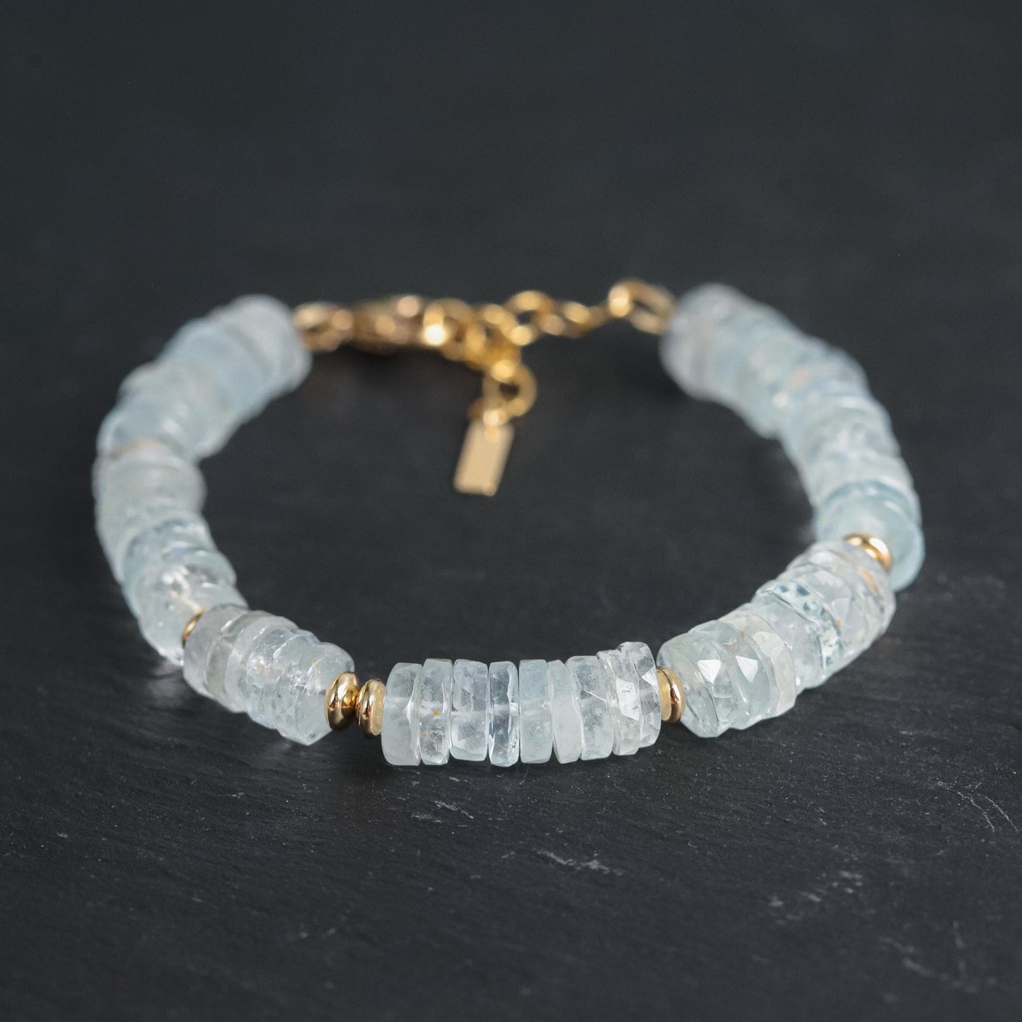 Blue Topaz Heishi bracelet with round blue topaz beads and a stretch elastic band, crafted by Earthly Abundance.