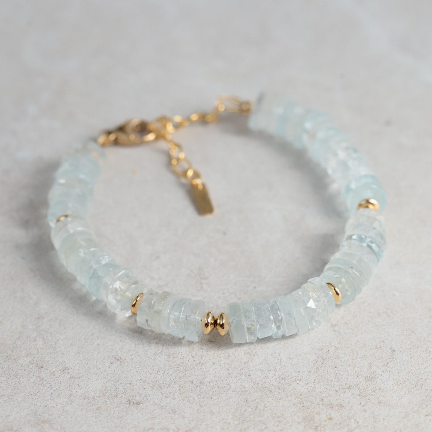 Blue Topaz Heishi bracelet featuring small, round blue topaz beads on a stretchy cord, crafted by Earthly Abundance.
