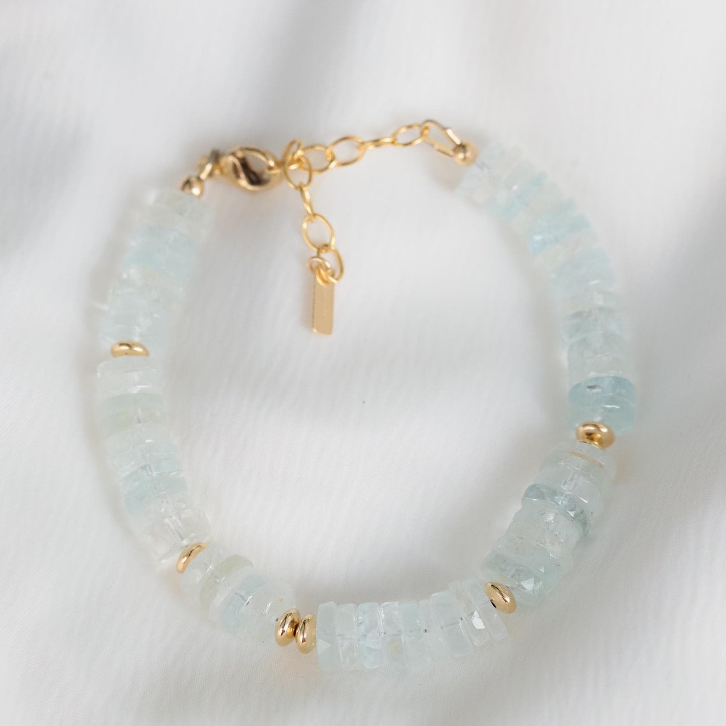 Blue Topaz Heishi bracelet featuring smooth, round blue topaz beads on a stretchy cord from Earthly Abundance.