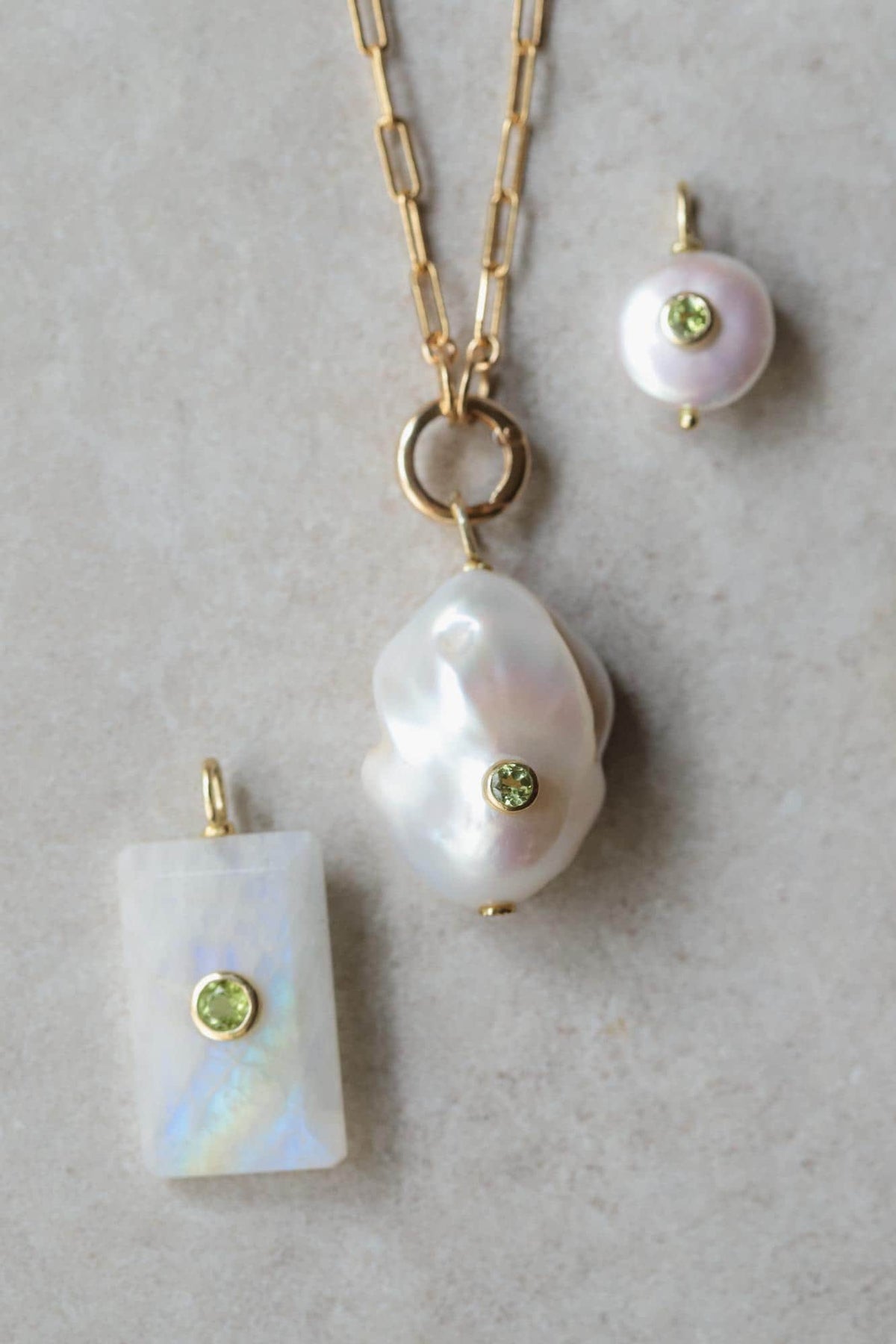 Earthly Abundance Moonlight Bar Moonstone pendant hanging on a chain, showcasing the luminous moonstone gemstone and elegant design.