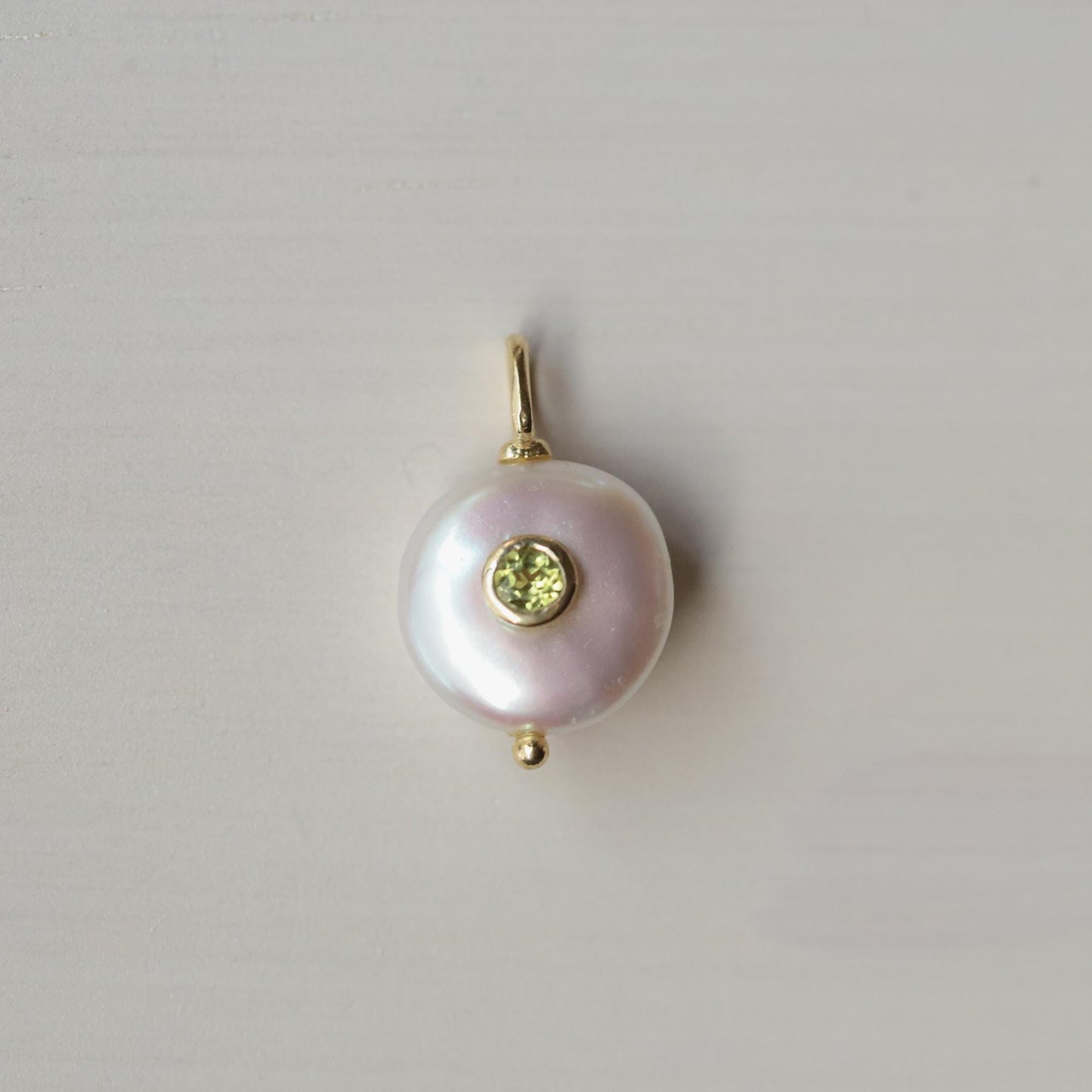 Elegant Solace Pearl Peridot Necklace by Earthly Abundance featuring a pearl and peridot gemstone pendant on a delicate chain