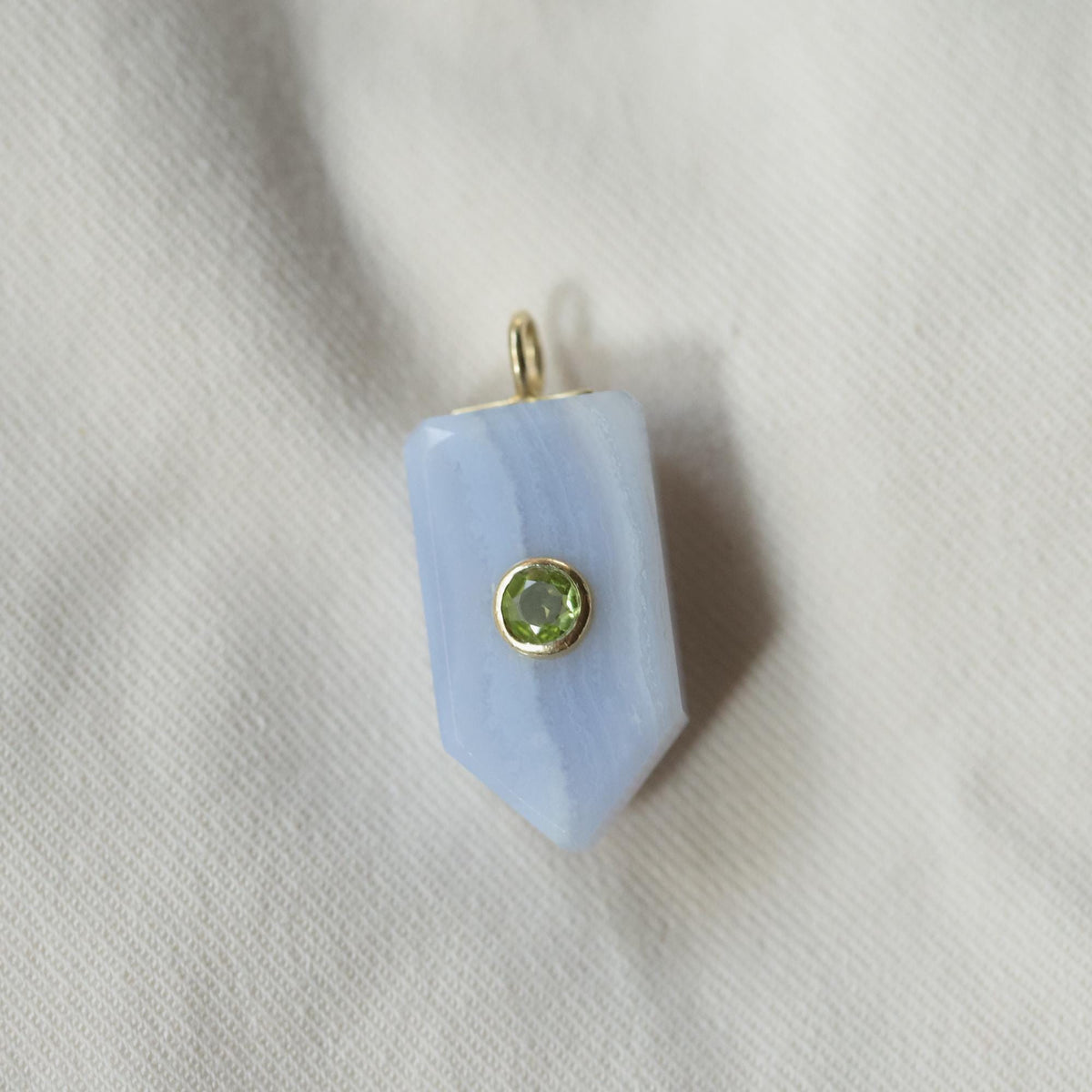 Horizon blue lace and Peridot necklace by Earthly Abundance featuring delicate lace detailing and a vibrant Peridot gemstone pendant.