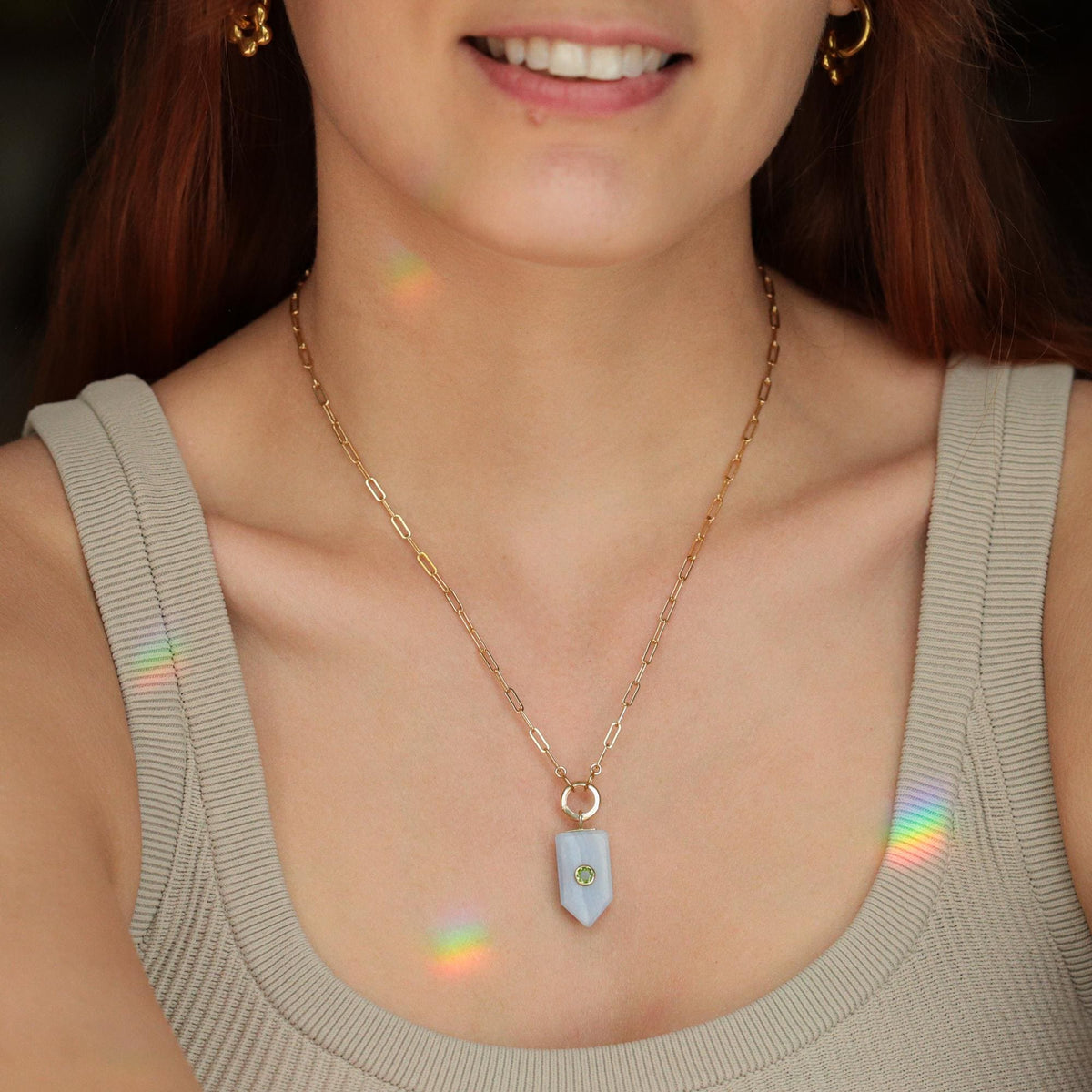 Soft horizon blue lace Aate Peridot necklace by Earthly Abundance featuring delicate lace and vibrant green Peridot gemstone accents.