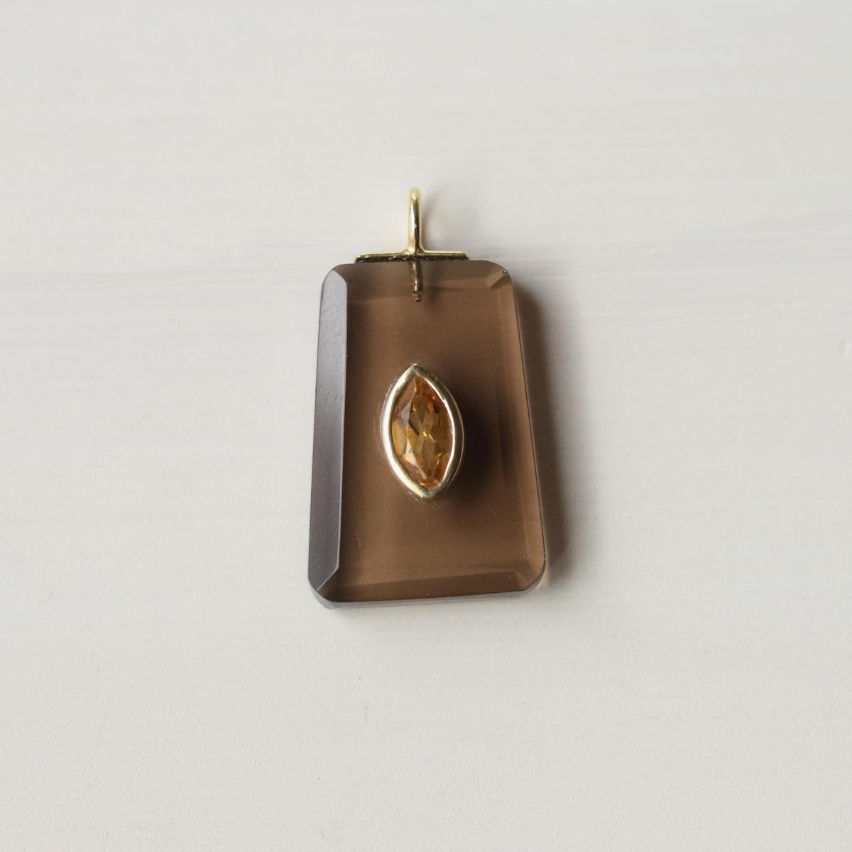 Golden Depth Smoky Quartz necklace featuring a polished smoky quartz pendant on a delicate chain by Earthly Abundance.