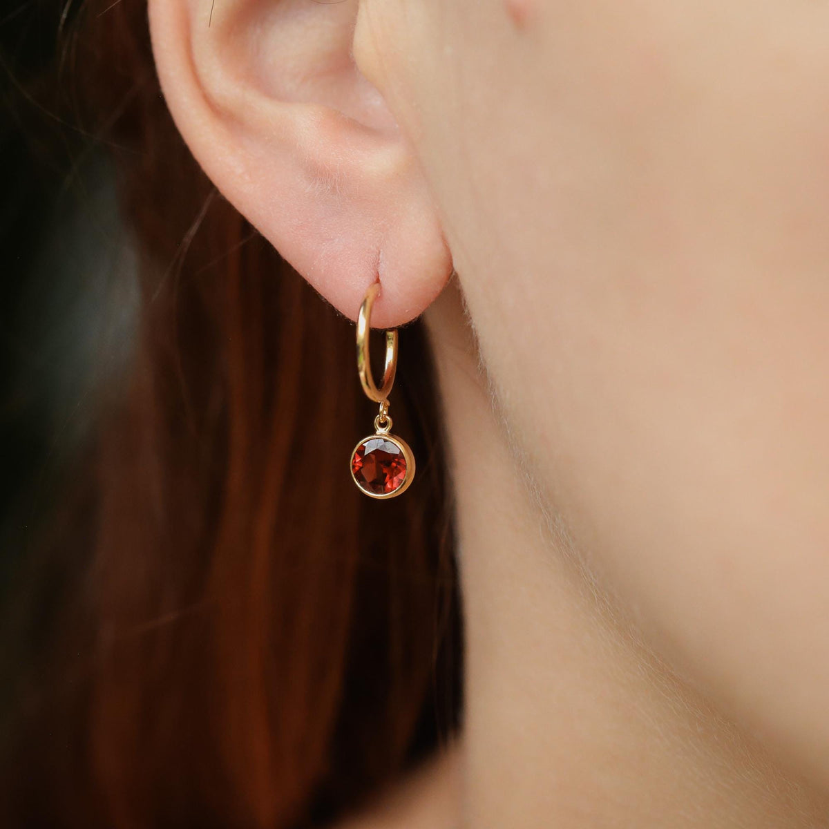 Garnet hoop earrings in 14K gold filled with vibrant red garnet stones, stylish jewelry accessory from Earthly Abundance.