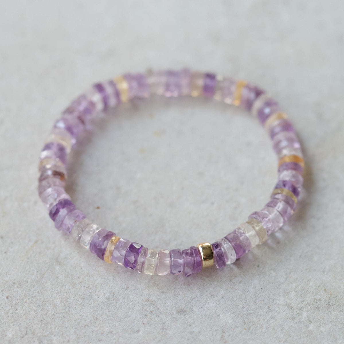 Ametrine Heishi bracelet by Earthly Abundance featuring small, colorful gemstone beads strung together on a stretch cord.