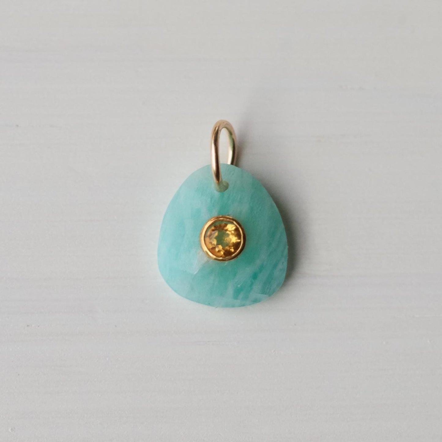 Golden Tide Pendant featuring Amazonite and Citrine gemstones by Earthly Abundance, showcasing the detailed gold-tone pendant design.