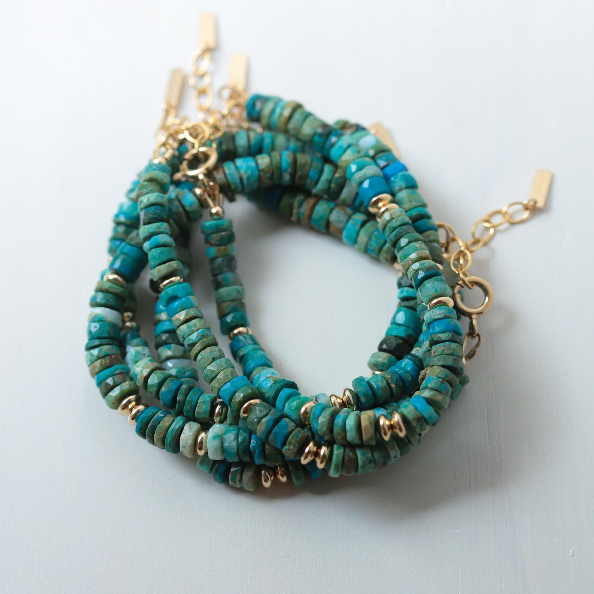 Heishi Chrysocolla bracelet with 14K gold-filled accents, featuring smooth round blue-green stones and gold spacers.