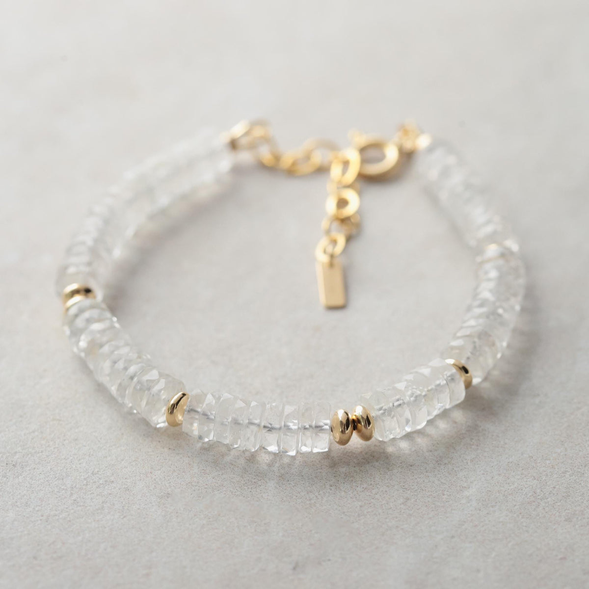 Elevated Energy Clear Quartz bracelet by Earthly Abundance featuring polished transparent quartz beads on an elastic band.