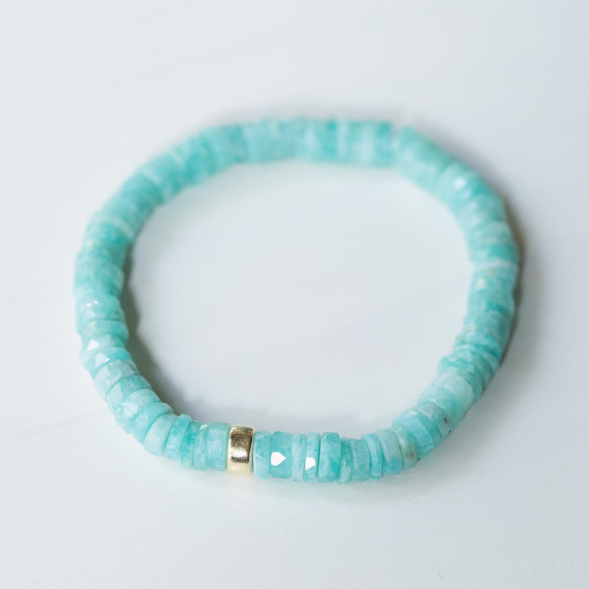 Earthly Abundance Amazonite Heishi bracelet featuring small, round turquoise beads on a stretch elastic band.