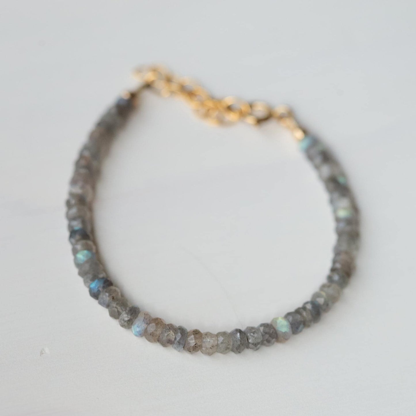Labradorite protection bracelet from Earthly Abundance featuring polished Labradorite stones on an elastic band.
