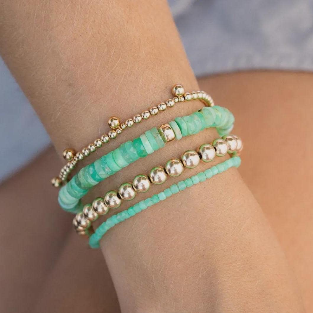 Chrysoprase cube bracelet featuring 14K gold accents from Earthly Abundance, showcasing polished green gemstone cubes on a delicate chain.