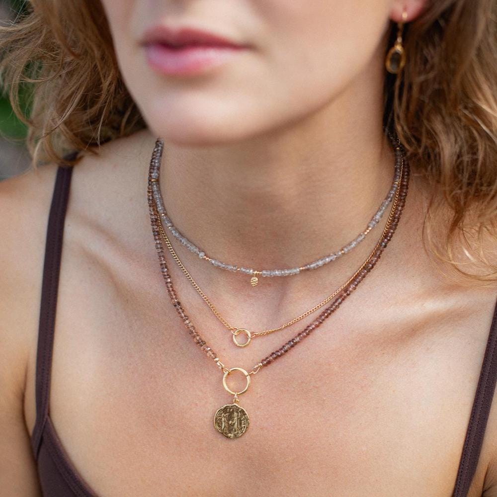 14k gold filled curb chain necklace by Earthly Abundance, showcasing a close-up of the elegant, shiny chain links.