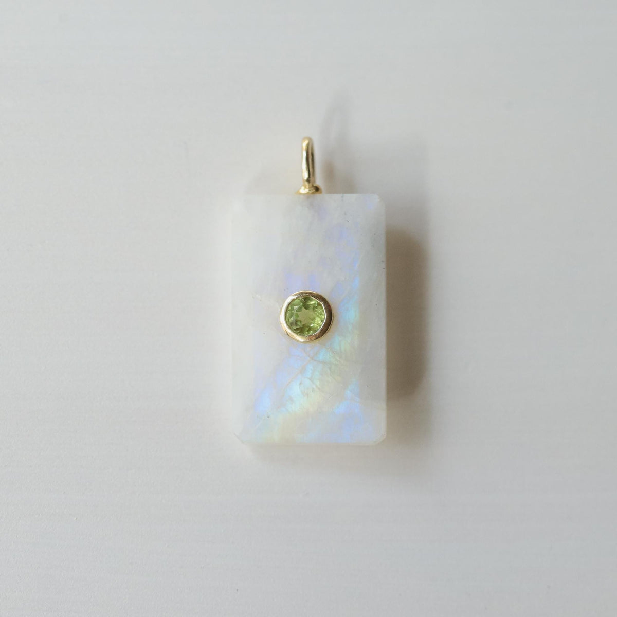 Earthly Abundance Moonlight Bar Moonstone pendant showcasing a sleek, elongated moonstone gemstone on a silver chain.