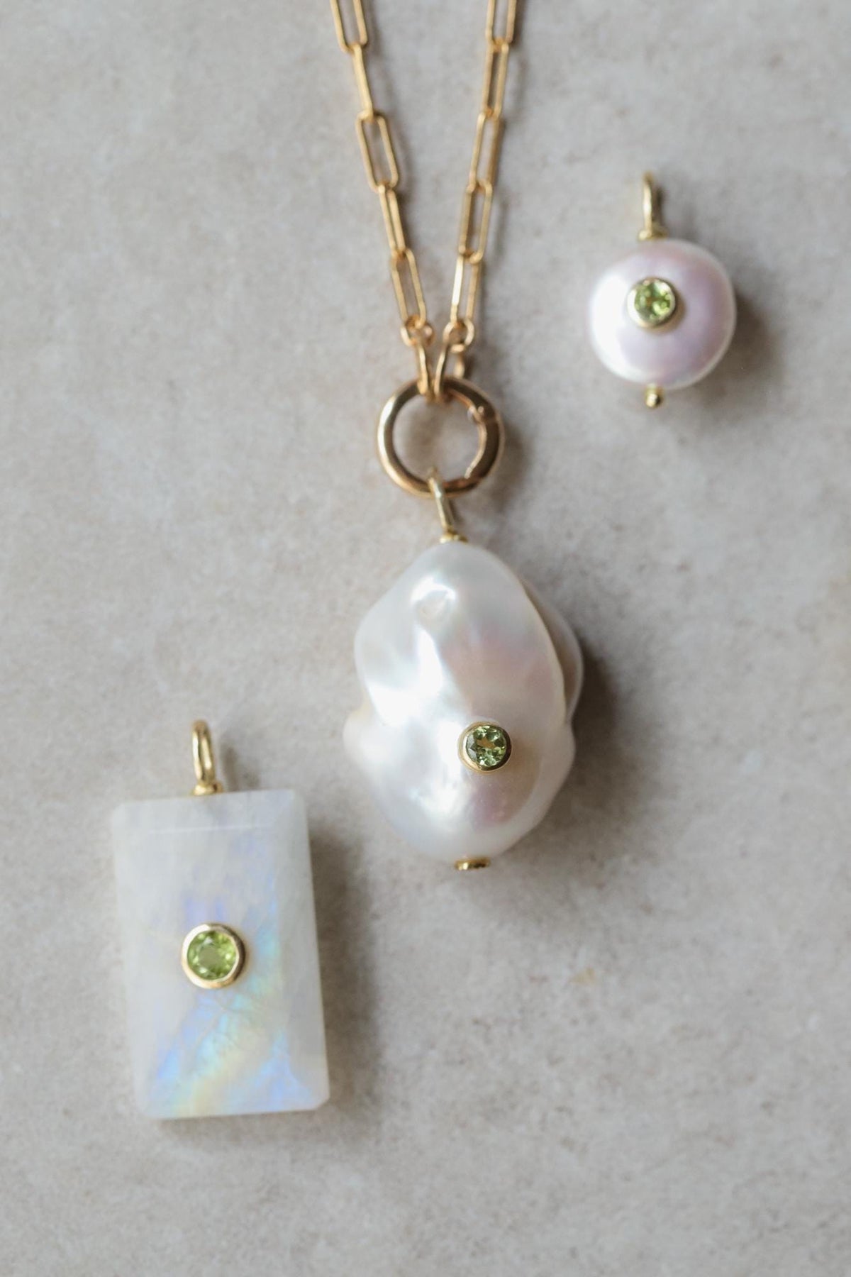 Lumen Baroque Pearl and Peridot Necklace by Earthly Abundance featuring a string of irregular pearl and vibrant green peridot beads