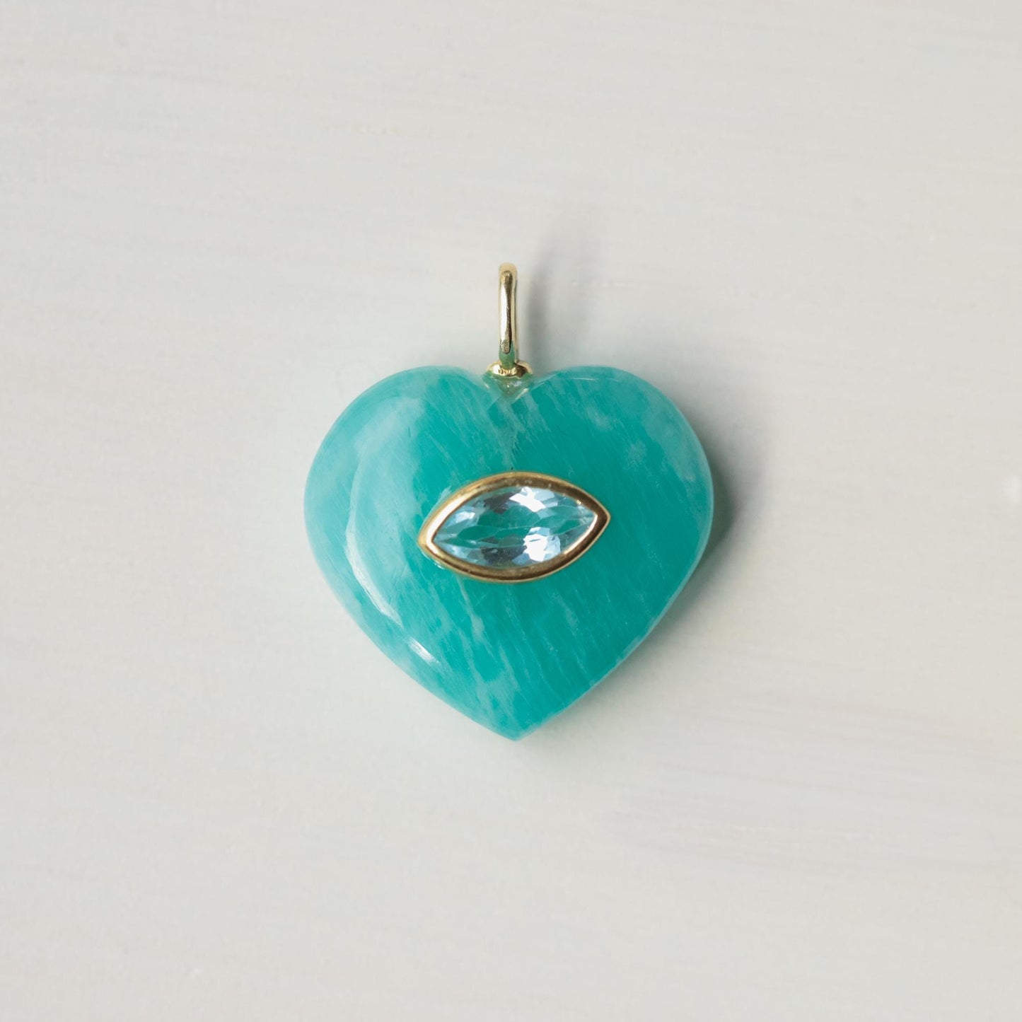 Clear heart-shaped Amazonite pendant necklace from Earthly Abundance featuring a polished gemstone on a delicate chain.