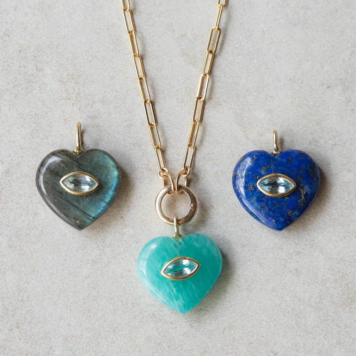 Clear heart-shaped Amazonite pendant necklace by Earthly Abundance featuring a polished blue-green gemstone on a delicate chain.