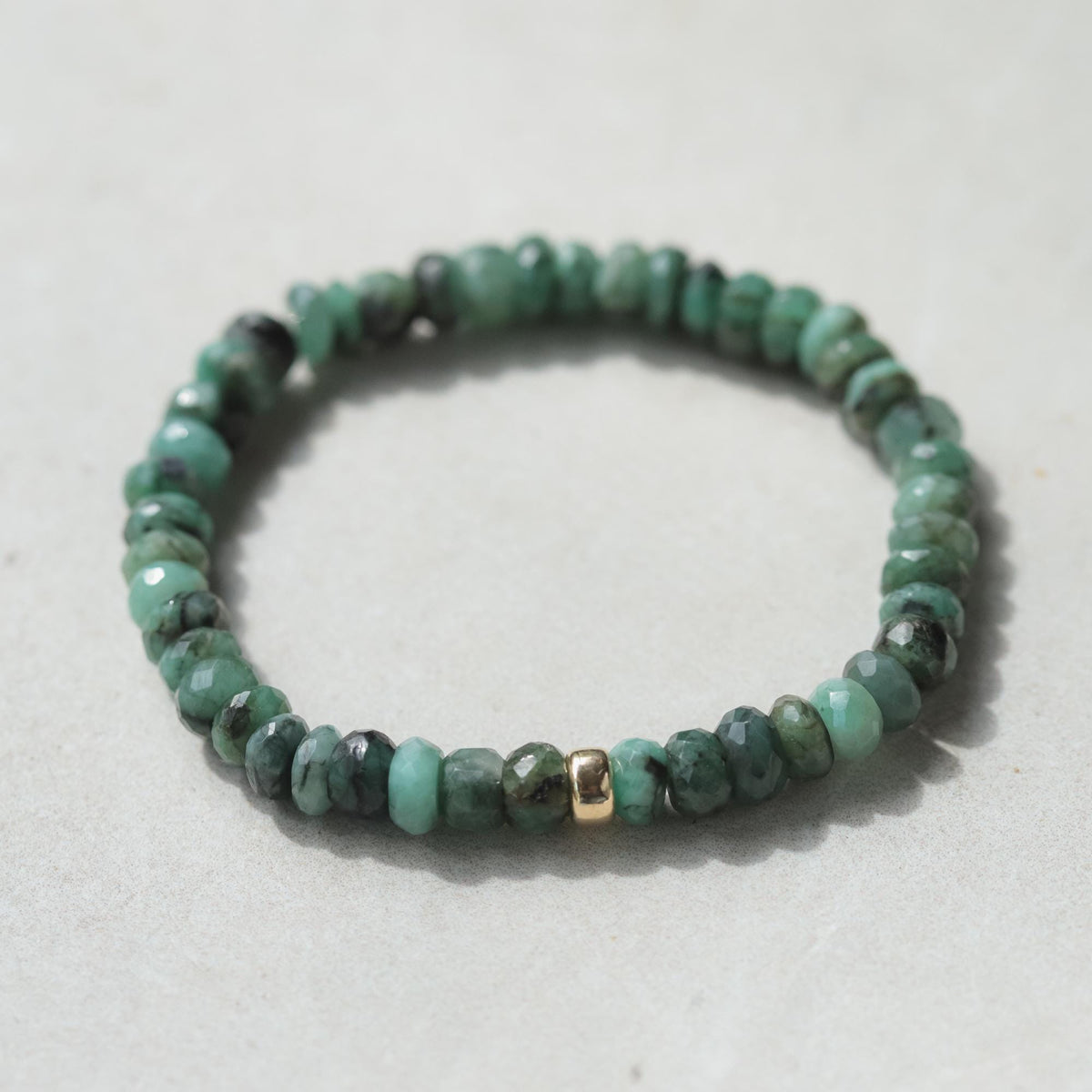 Forest green emerald bracelet by Earthly Abundance featuring polished emerald gemstones on a delicate silver chain.
