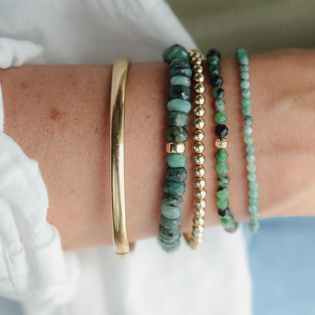 Forest green emerald bracelet by Earthly Abundance featuring polished emerald beads and a delicate clasp.