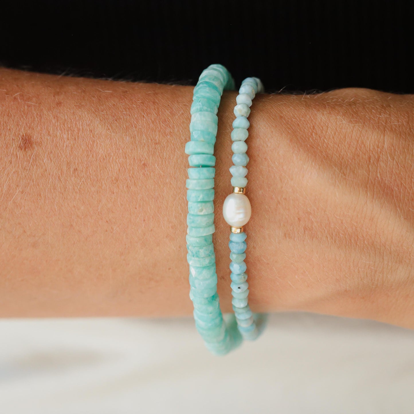 Soft Ocean Larimar Pearl Bracelet featuring smooth, blue larimar beads and pearls on a delicate elastic band.