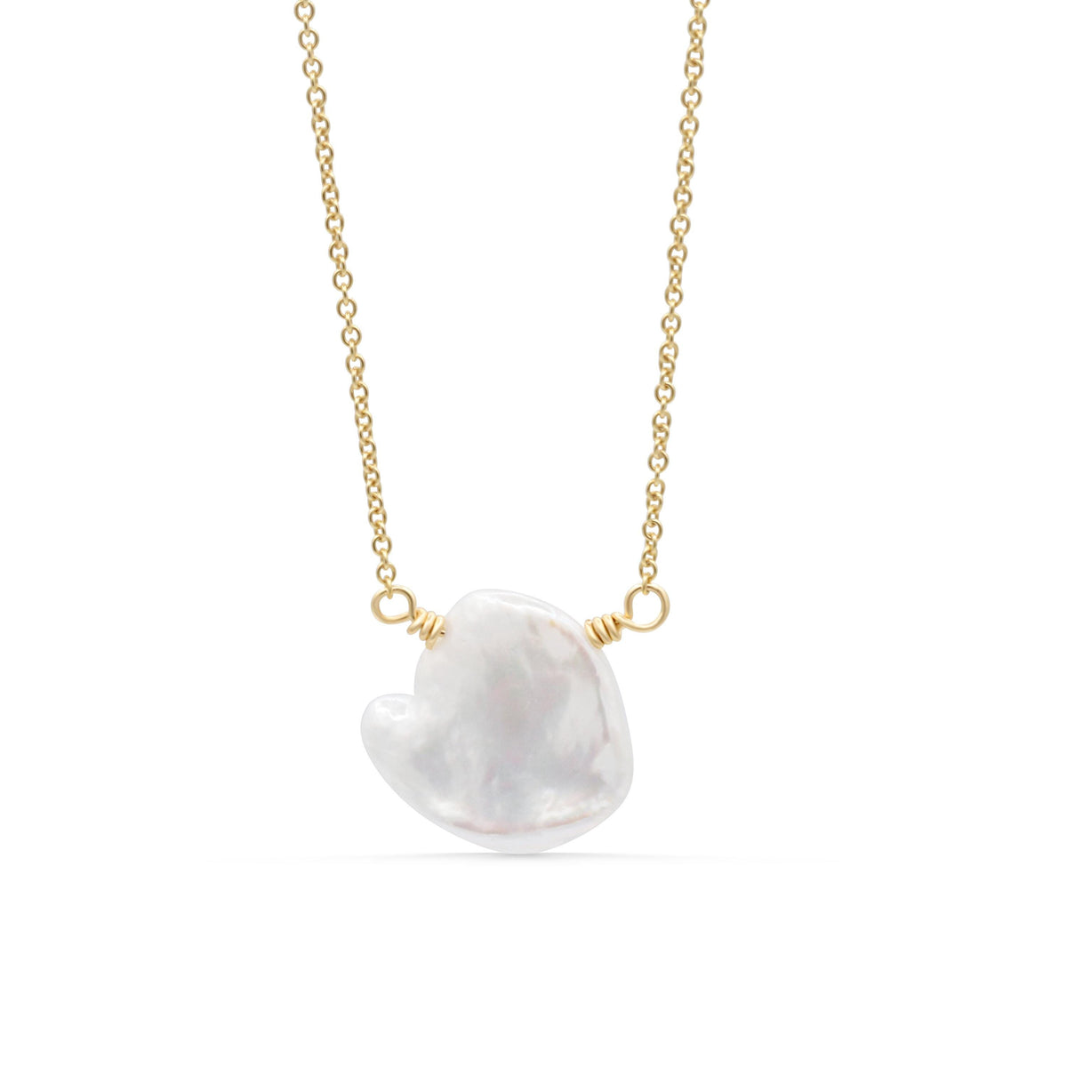 Elegant Etherea Pearl Necklace by Earthly Abundance featuring lustrous white pearls on a delicate chain.