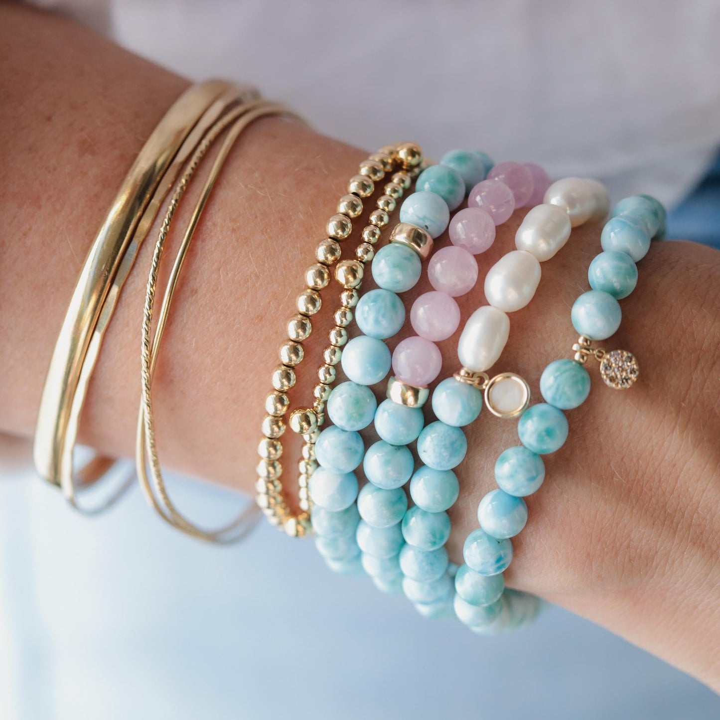Larimar and diamond bracelet by Earthly Abundance featuring a delicate design with blue larimar stones and sparkling diamonds.