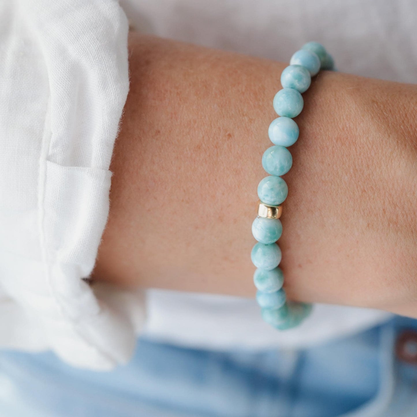 Rare Beauty Larimar bracelet by Earthly Abundance featuring smooth blue gemstone beads on a delicate elastic band.
