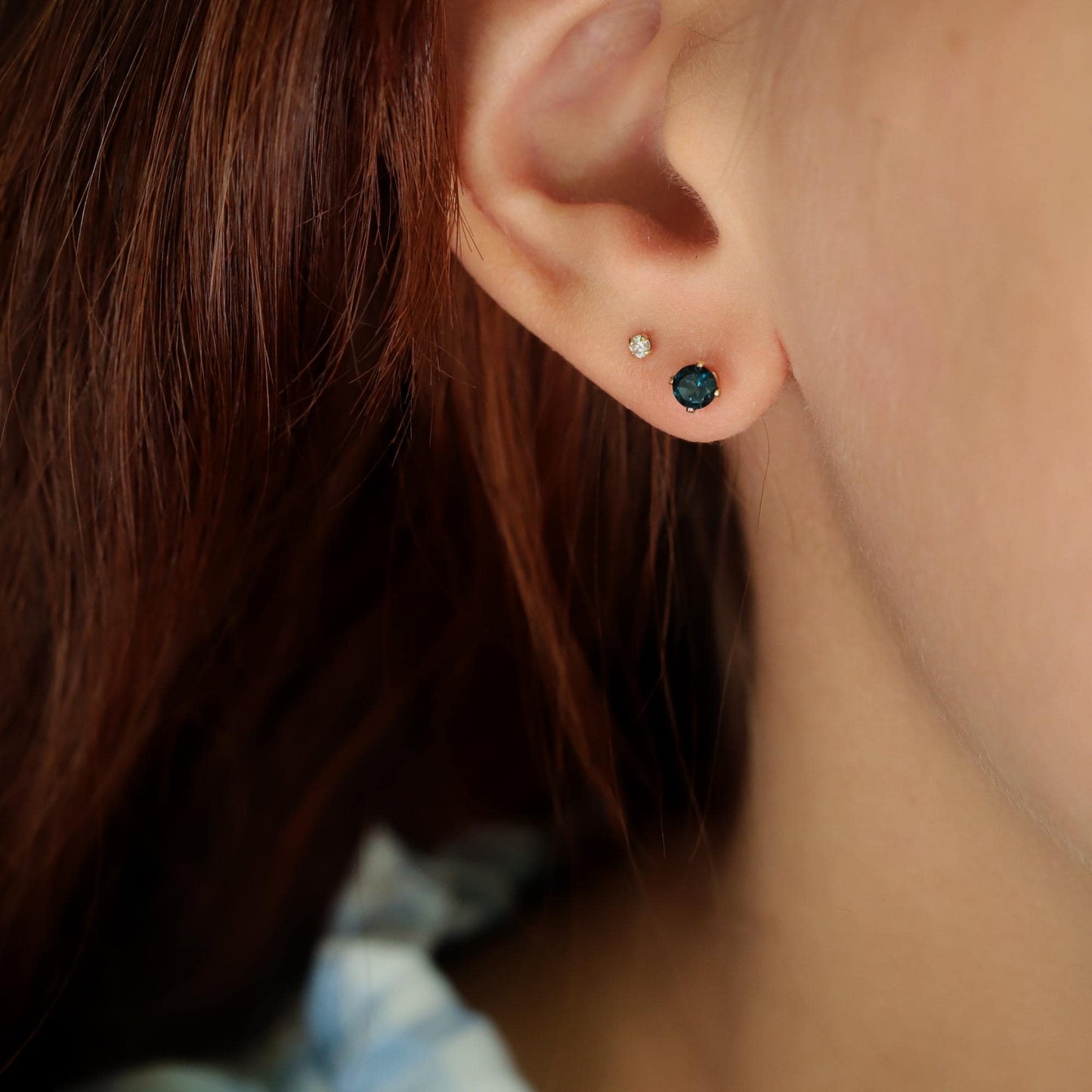 London Blue Topaz stud earrings by Earthly Abundance featuring sparkling blue topaz gemstones set in silver.