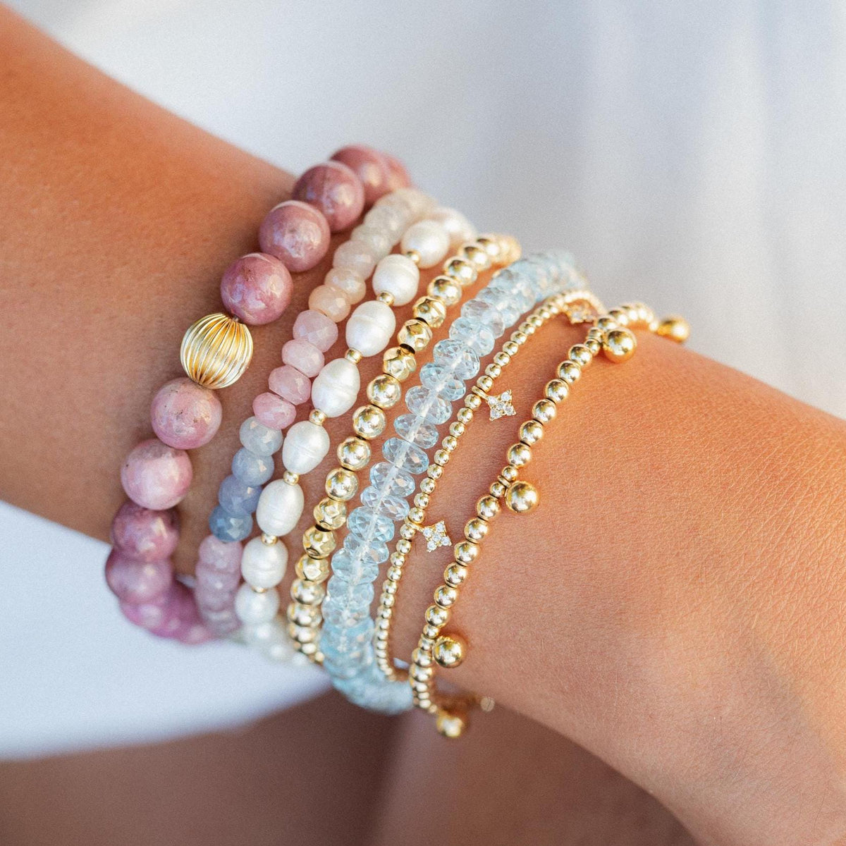 Soft Radiance Pearl bracelet featuring 14K gold accents from Earthly Abundance, showcasing smooth, lustrous pearls on a delicate chain.