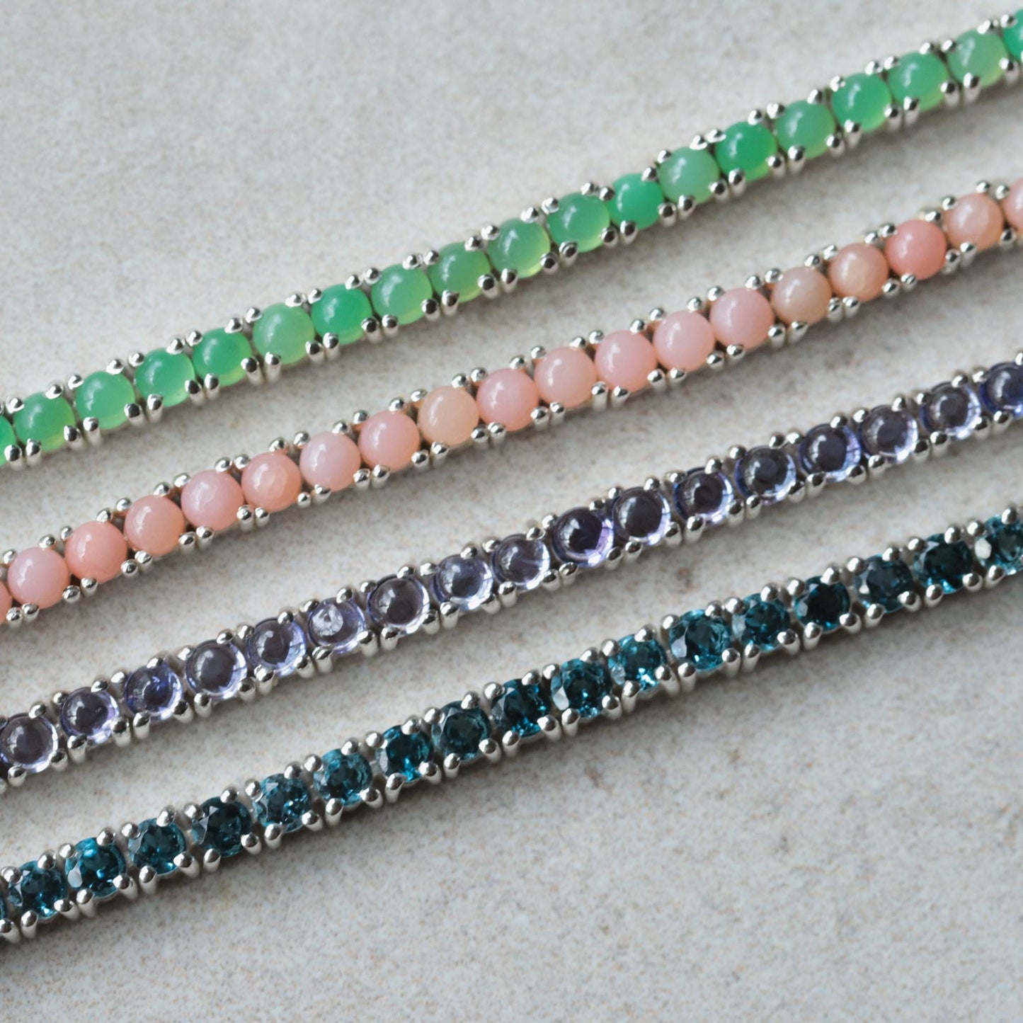 Pink Opal Tennis Bracelet by Earthly Abundance featuring a row of polished pink opal beads on a delicate silver chain.