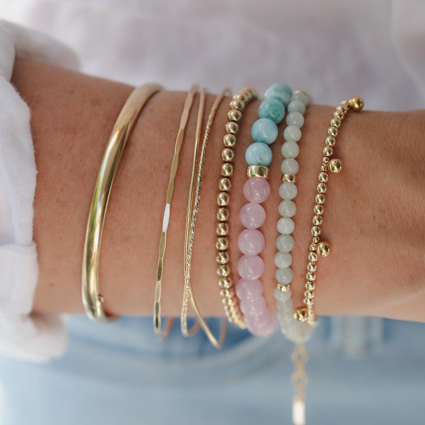 4mm jadeite bracelet featuring smooth green jade beads from Earthly Abundance, displayed on a neutral background.