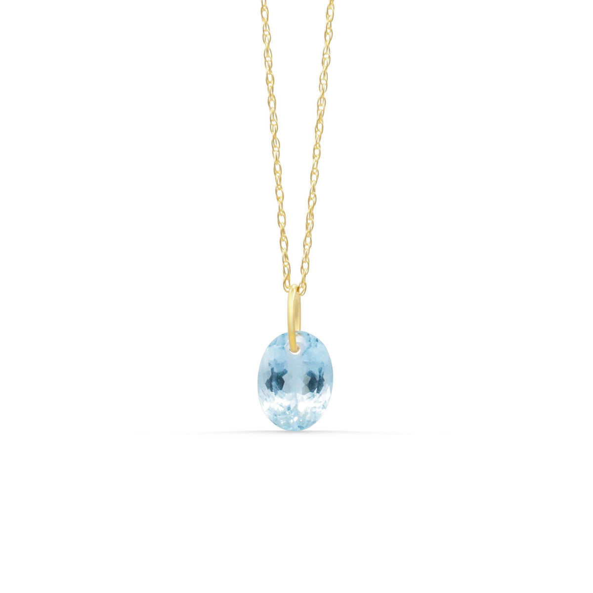 14K aquamarine pendant necklace featuring a sparkling blue gemstone on a delicate chain from Earthly Abundance.