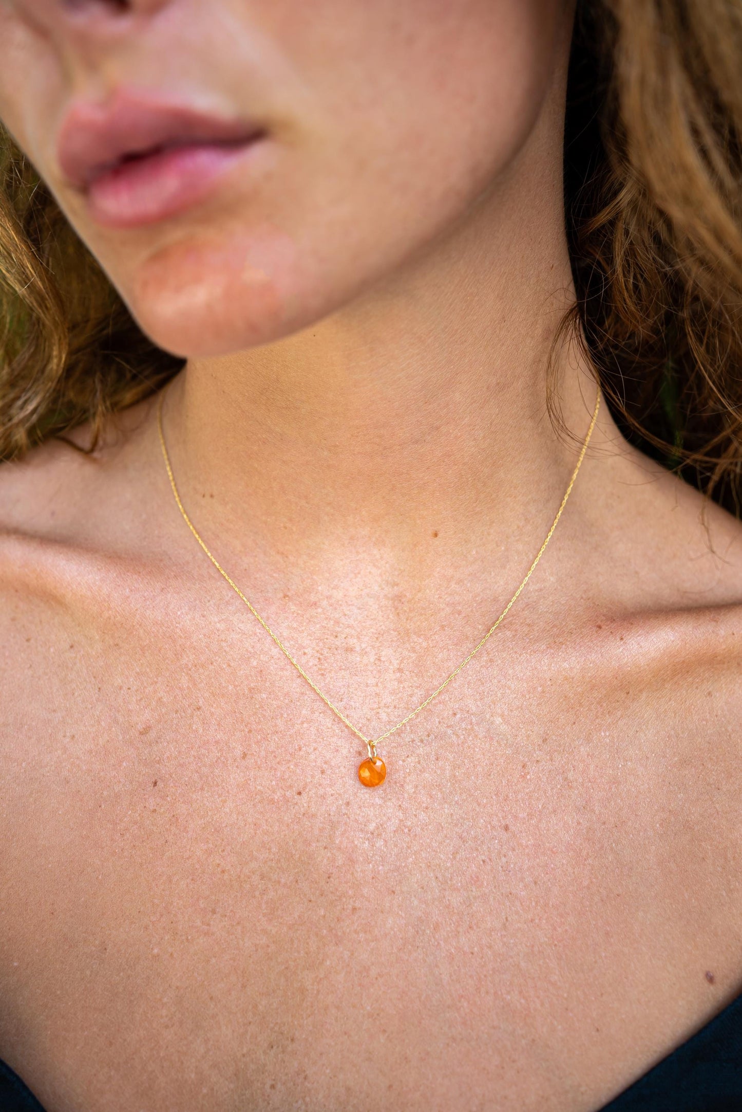 Mexican Fire Opal pendant necklace in 14K gold, featuring a vibrant fire opal gemstone on a delicate chain.